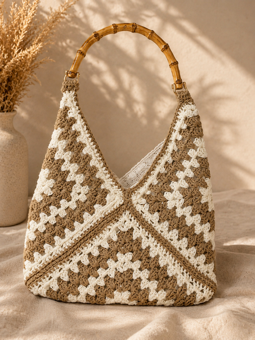 Side view of Chainettes beige and ivory cotton crochet bag with lining and bamboo handle