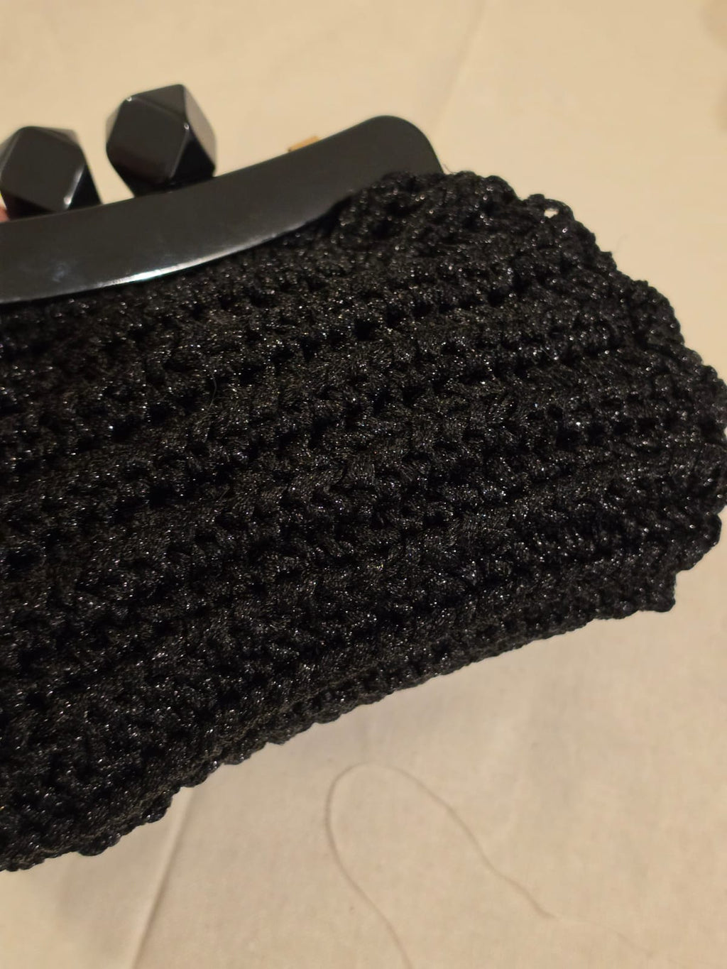 Close-up of black and silver cotton sirma crochet texture
