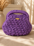 Purple handmade metallic leather bag with integrated handle and magic frame closure